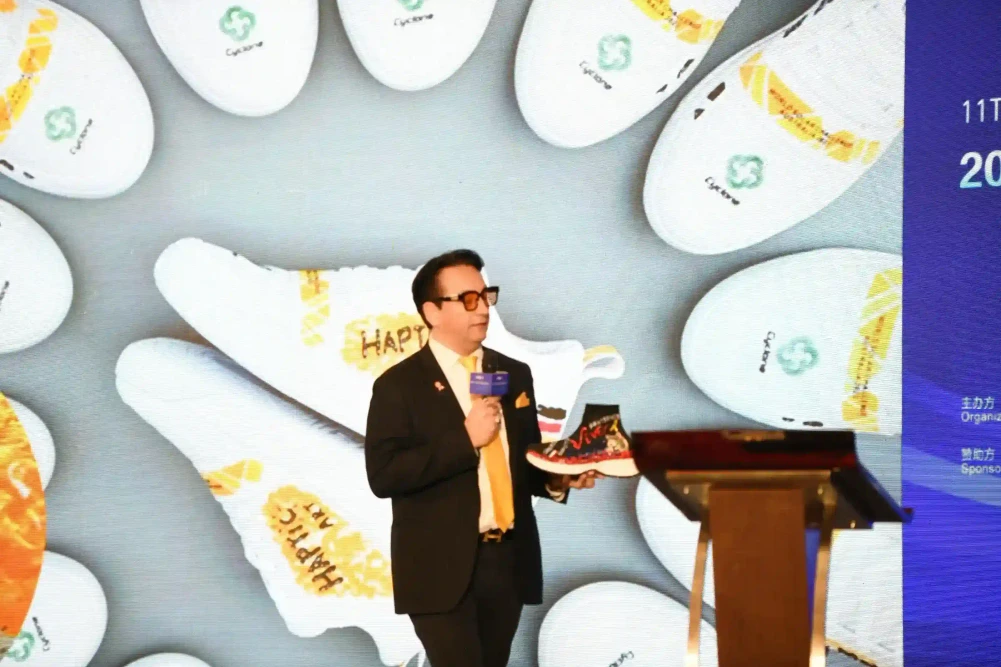 A speaker presents a new shoe design on stage
